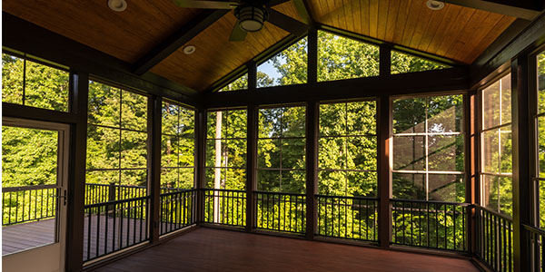actuate-additions_0002_modern-new-screened-porch-with-plastic-windows-and-composite-floor-with-summer-woods-in-the-backg